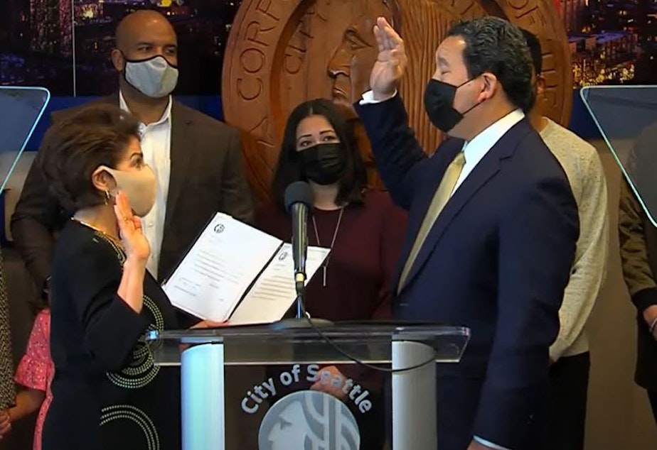 caption: Bruce Harrell is sworn in as Seattle mayor on Jan. 4, 2021. 