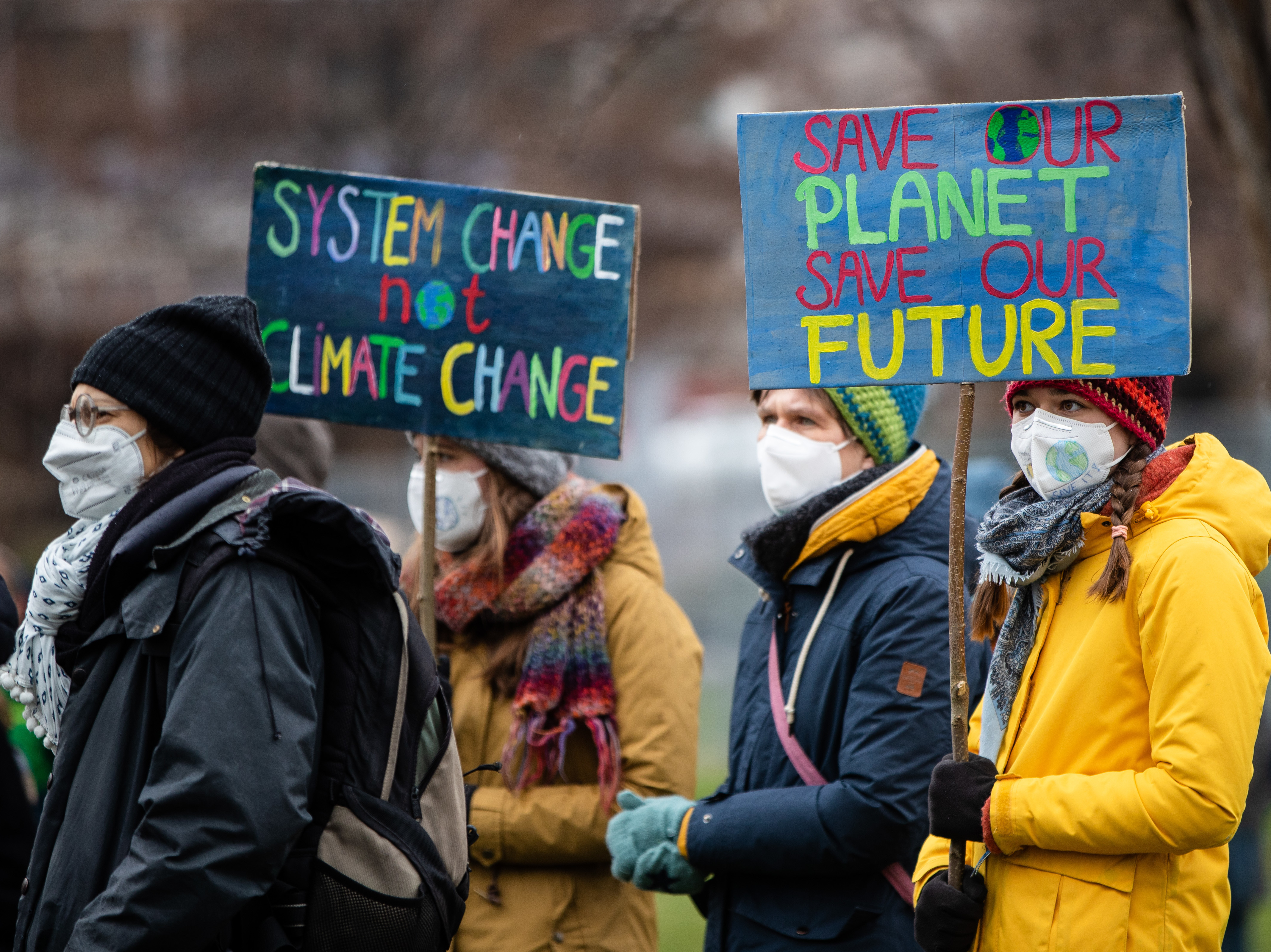 caption: Activists advocate for better climate protection at a demonstration last month in Stuttgart, Germany.