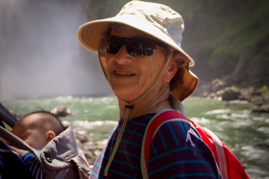 caption: Fran Goldman takes a hike - while one of her great -grandsons takes a nap -  in 2018. Goldman walked six miles roundtrip in nearly a foot of snow on February 14, 2020, to get her first dose of the COVID-19 vaccine.