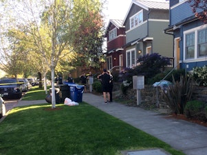 caption: The white garbage bags contained what appeared to be human remains. It was found by a resident on the 1600 block of 21st Avenue in Seattle's Central District.