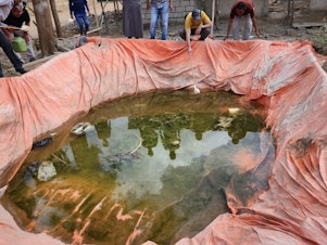caption: Manmade pits at construction sites are providing nurseries for malaria-carrying mosquitoes, new research finds.