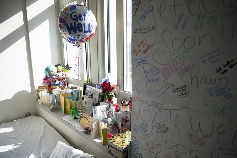 caption: Cards and flowers fill a windowsill next to the small cot where LaDonna Horne slept on Thursday, March 15, 2018, in DaShawn Horne's room at Harborview Medical Center in Seattle. "The outpour was just pure love," LaDonna said. "Strangers from all over. I didn’t know any of these people, but we’re friends now."