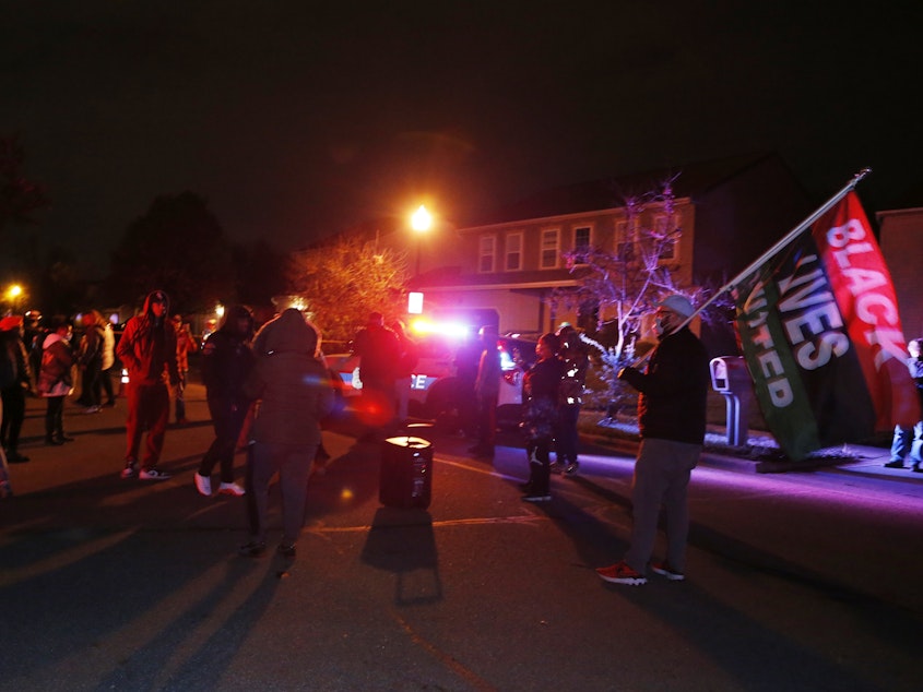 caption: A crowd gathers to protest in the neighborhood where a police officer fatally shot a teenage girl on Tuesday in Columbus, Ohio.
