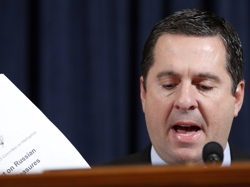 caption: Ranking member Rep. Devin Nunes, R-Calif., makes an opening statement as former White House national security aide Fiona Hill, and David Holmes, a U.S. diplomat in Ukraine, testify before the House Intelligence Committee on Capitol Hill last month.
