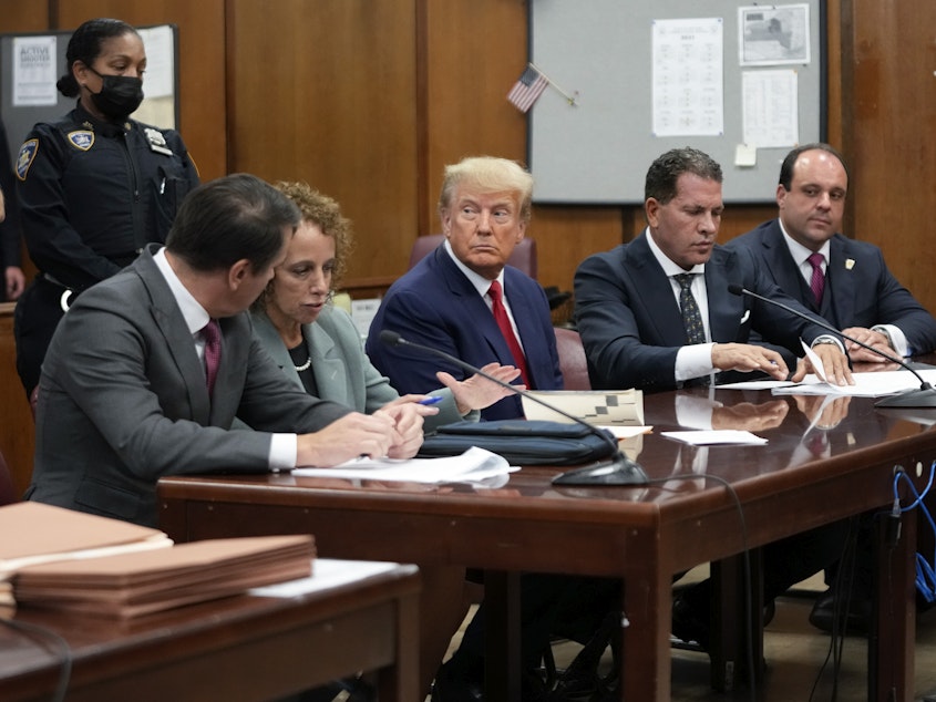 caption: Former President Donald Trump in court for his arraignment in New York Tuesday. The judge overseeing the case did not issue a gag order. Instead he warned against saying or doing anything that could incite violence, create civil unrest or jeopardize the safety or well-being of any individuals.