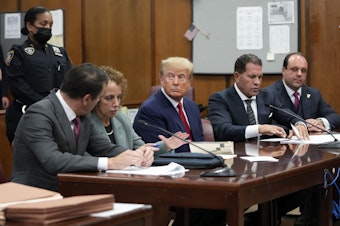 caption: Former President Donald Trump in court for his arraignment in New York Tuesday. The judge overseeing the case did not issue a gag order. Instead he warned against saying or doing anything that could incite violence, create civil unrest or jeopardize the safety or well-being of any individuals.