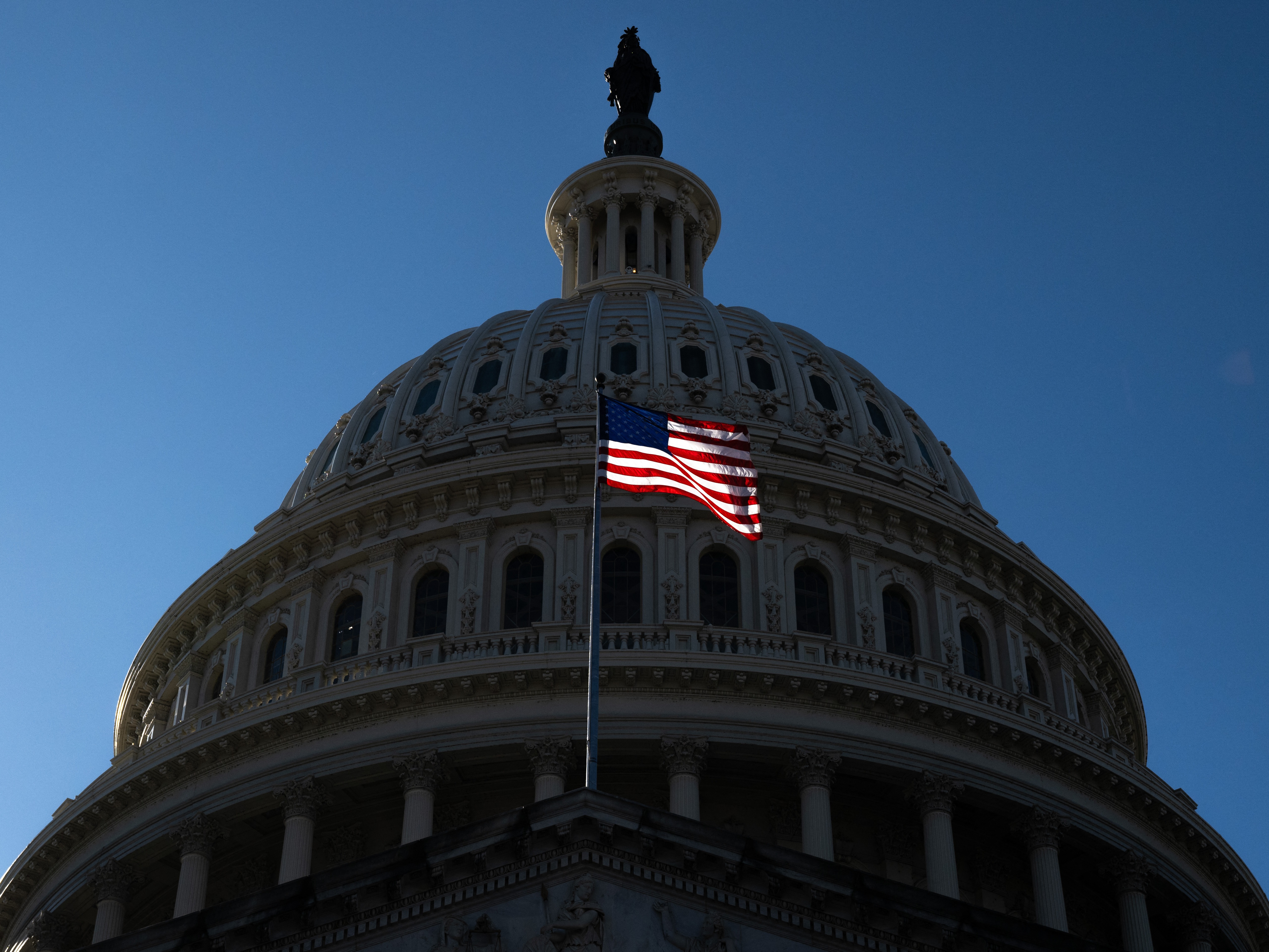 caption: A new analysis from the Congressional Budget Office shows the top 10% of earners in the U.S. would see the biggest gains from the House-passed tax and spending package. Those at the bottom of the income ladder would be worse off.