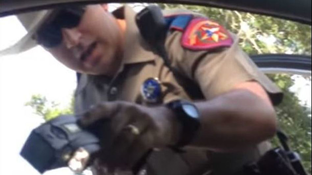 caption: Cellphone footage taken by Sandra Bland shows her encounter with state Trooper Brian Encinia that led to her arrest in 2015. (Investigative Network/On Point Screenshot)