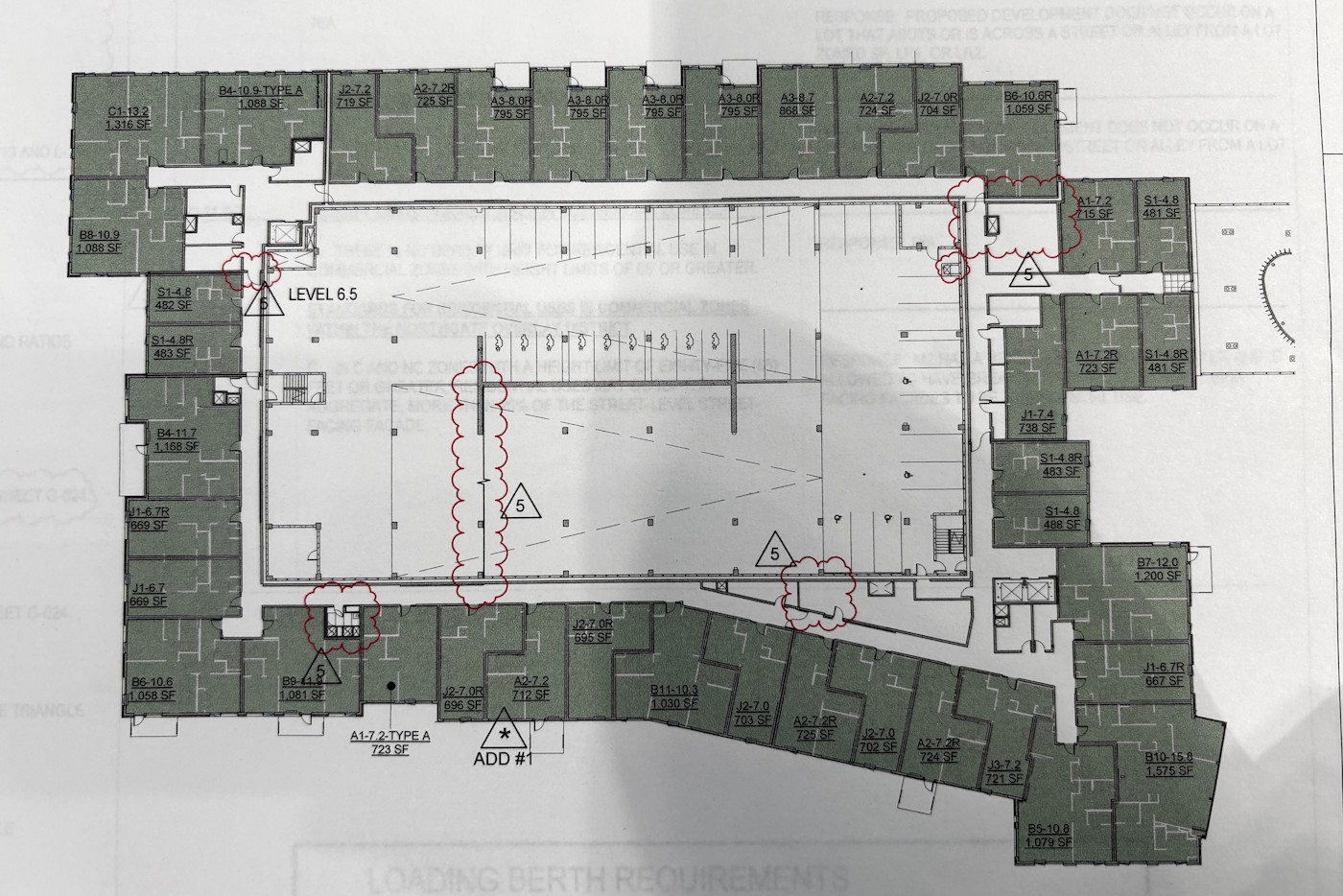 caption: A building plan shows parking in the center of a donut of apartment units in the new apartment building replacing a former Northgate Mall parking lot. 