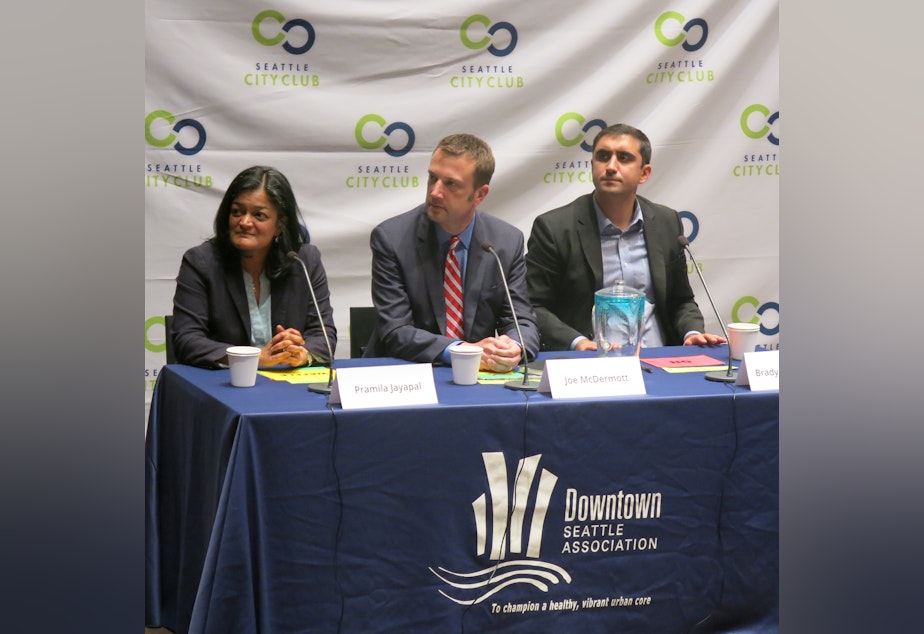 caption: From left to right, Pramila Jayapal, Joe McDermott and Brady Walkinshaw at 7th Congression District debate in July.
