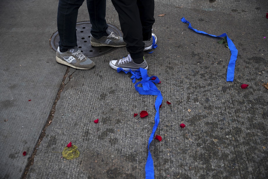 caption: Rose pedals and blue streamers are shown on the ground during an impromptu celebration after Joe Biden was officially named the president elect on Saturday, November 7, 2020, at the intersection of 10th Avenue and East Pine Street in Seattle.