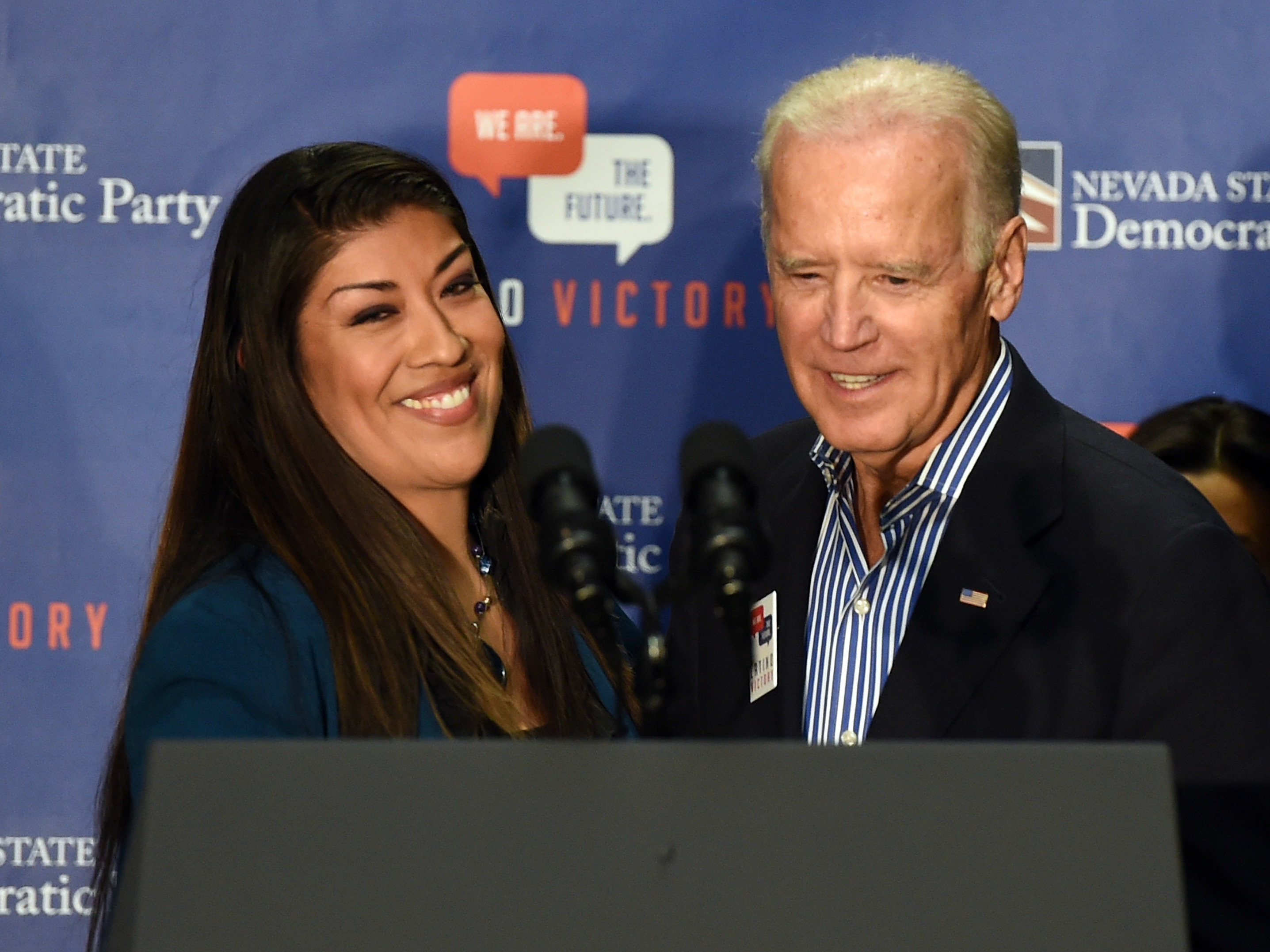 caption: Then-Democratic candidate for lieutenant governor Lucy Flores and then-Vice President Joe Biden at a rally on Nov. 1, 2014 in Las Vegas. Flores accuses Biden of acting inappropriately during that visit.