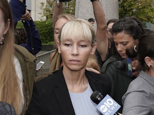 caption: Sherri Papini leaves a federal courthouse Monday after Judge William Shubb sentenced her to 18 months in federal prison for faking her own kidnapping in 2016.