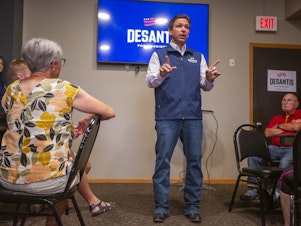caption: GOP presidential candidate Ron DeSantis speaks during a campaign event at Olde Boston's Restaurant & Pub in Fort Dodge, Iowa on July 14.