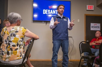 caption: GOP presidential candidate Ron DeSantis speaks during a campaign event at Olde Boston's Restaurant & Pub in Fort Dodge, Iowa on July 14.