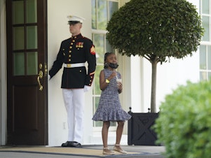 caption: Gianna Floyd, the daughter of George Floyd, is seen after meeting with President Biden and Vice President Harris at the White House Tuesday.