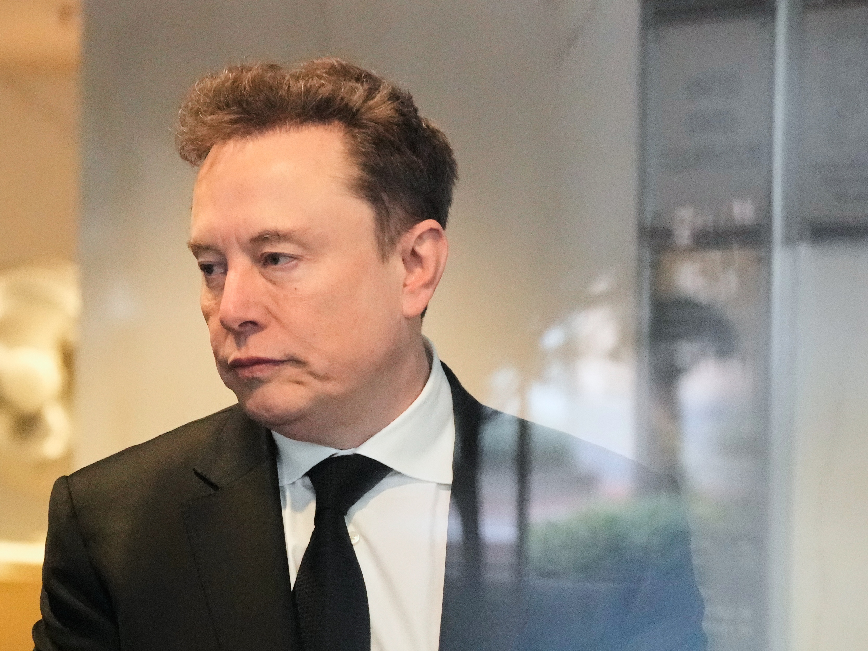 caption: Elon Musk arrives at the U.S. District Court in Oakland, Calif., Tuesday, April 28, 2026.