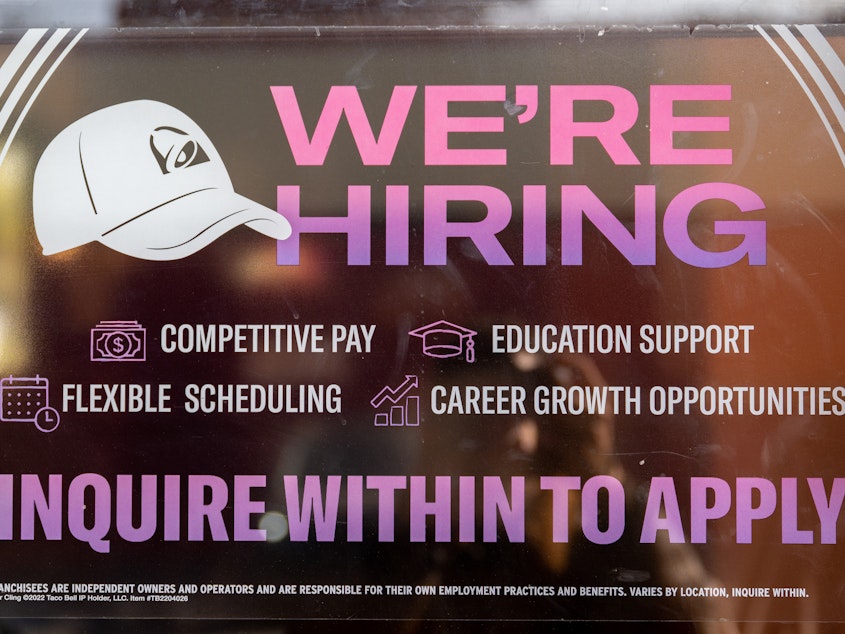 caption: A call for employment sign is displayed at a Taco Bell in Austin, Texas, on March 10, 2023. The labor market is slowing as higher interest rates start to filter through the economy.