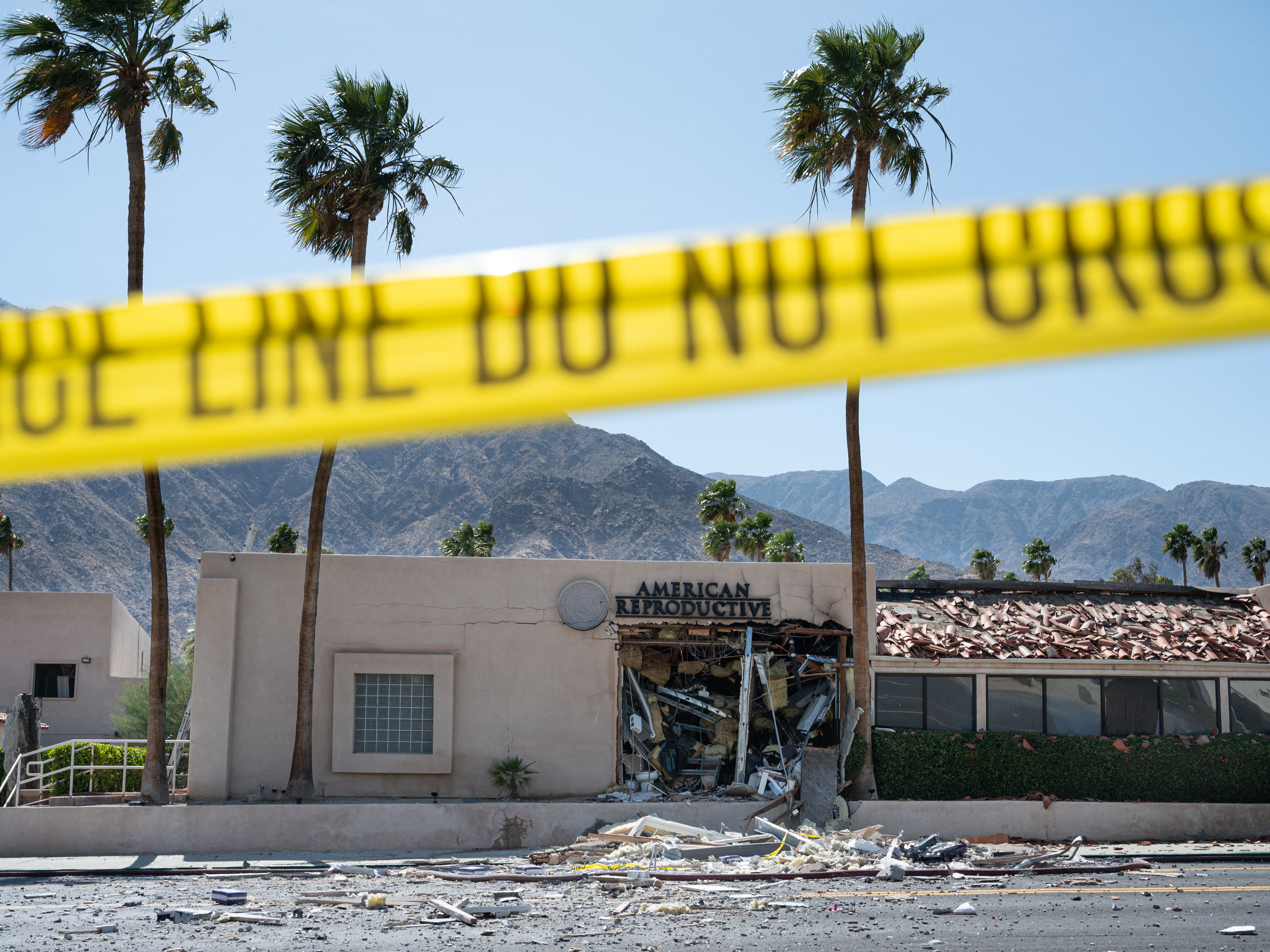 caption: Police tape is seen outside the American Reproductive Centers fertility clinic in Palm Springs, which was damaged in a bombing on Saturday.