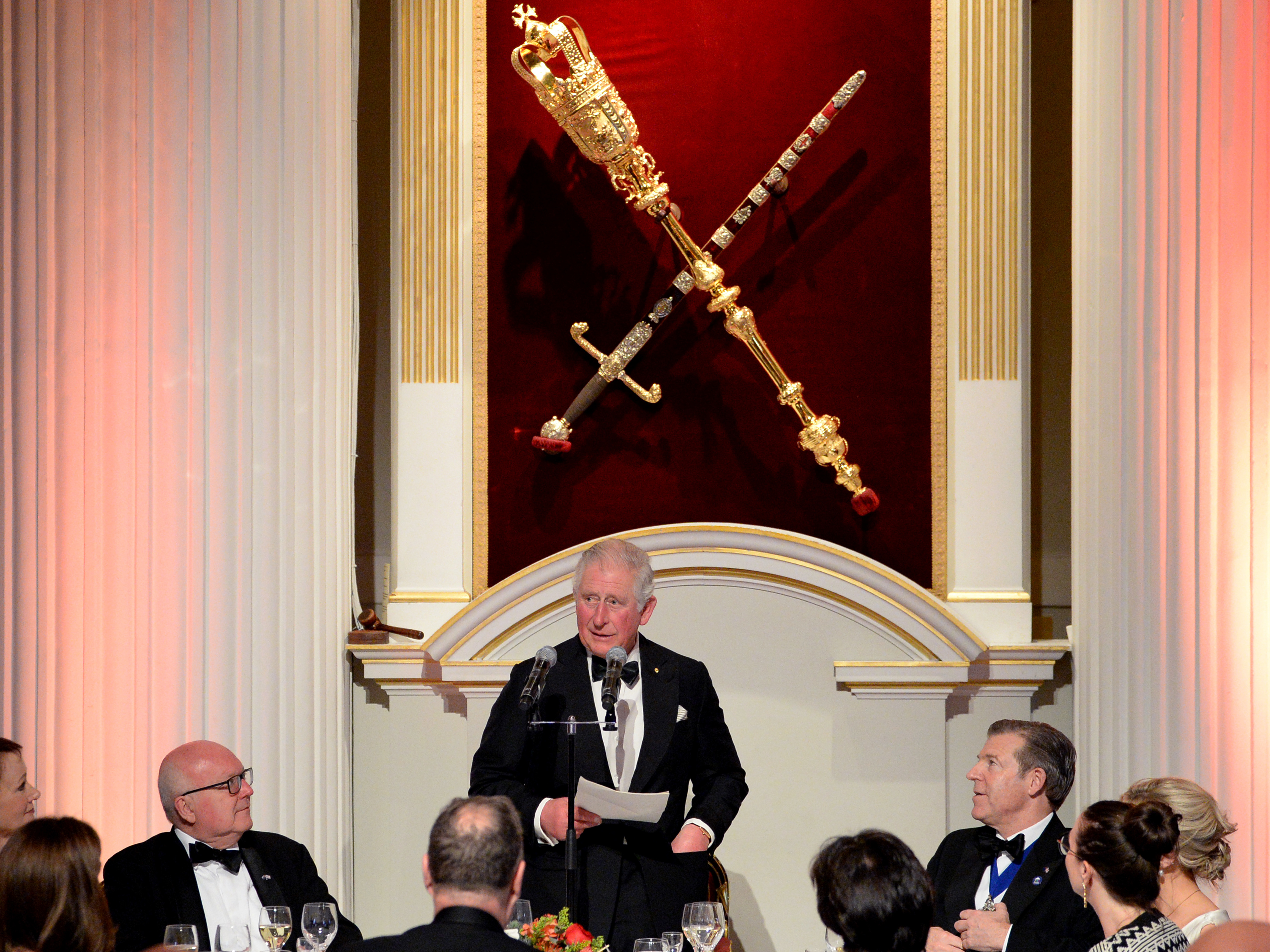 caption: Prince Charles has tested positive for coronavirus and is showing some symptoms of COVID-19. The heir to the British throne is seen here speaking at a large event on March 12, when he attended a dinner at Mansion House in London.