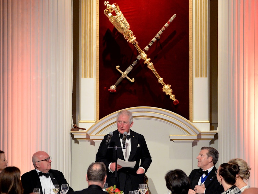 caption: Prince Charles has tested positive for coronavirus and is showing some symptoms of COVID-19. The heir to the British throne is seen here speaking at a large event on March 12, when he attended a dinner at Mansion House in London.