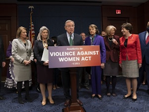 caption: Senate Judiciary Chair Dick Durbin, D-Ill., center, holds a news conference to announce a bipartisan update to the Violence Against Women Act at the Capitol on Feb. 9.