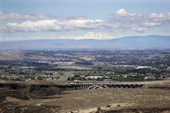 caption: In this photo taken Wednesday, June 17, 2020, Mount Adams rises in the distance beyond the the Yakima Valley, in Yakima, Washington. 
