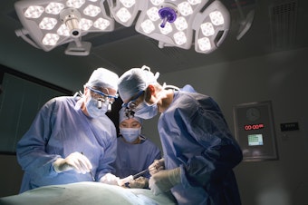 caption: The common practice of double-booking a lead surgeon's time and letting junior physicians supervise and complete some parts of a surgery is safe for most patients, a study of more than 60,000 operations finds. But there may be a small added risk for a subset of patients.