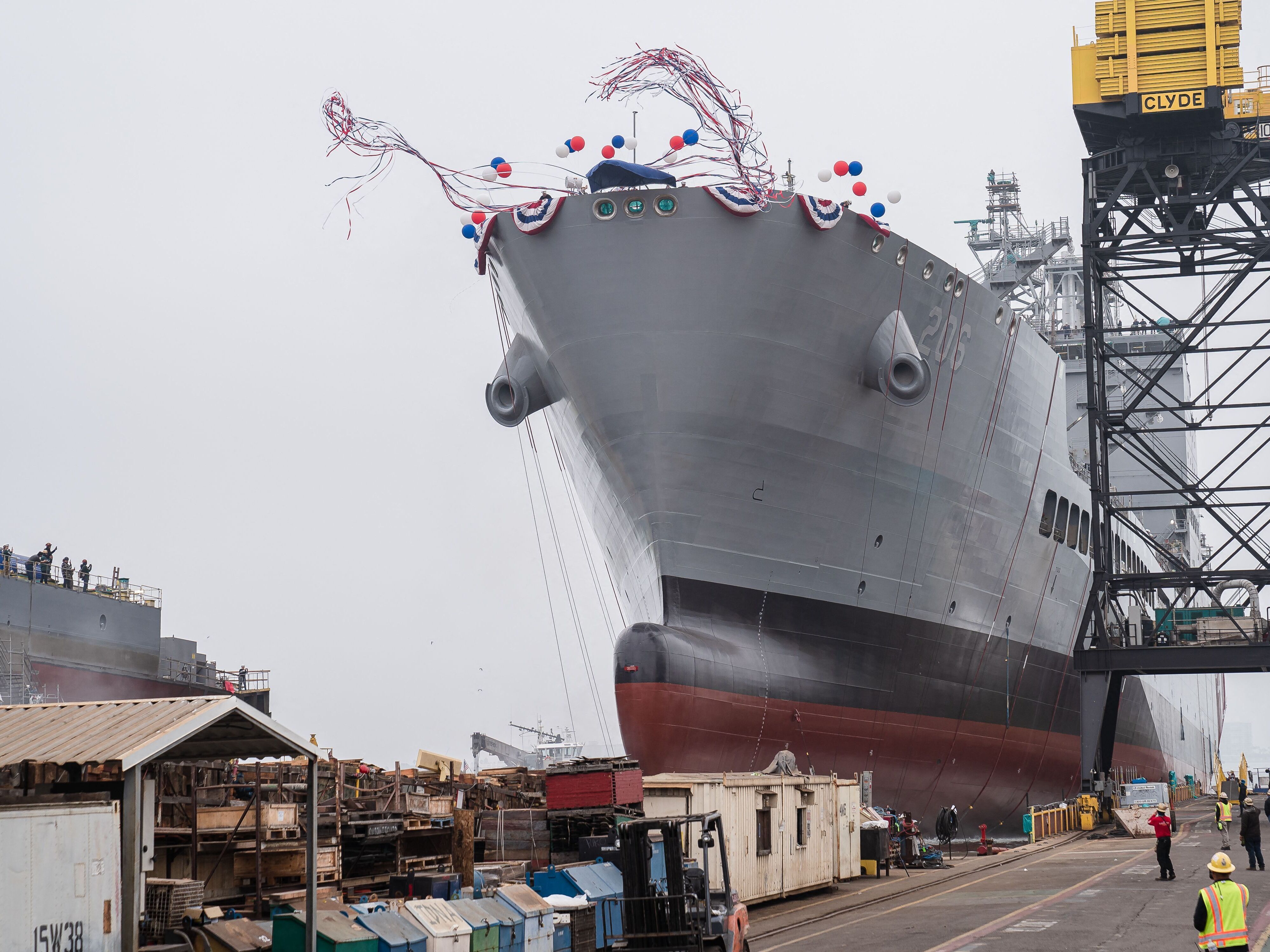 caption: The USNS Harvey Milk departs the General Dynamics NASSCO shipyard after a christening ceremony in San Diego, on Nov. 6, 2021. The ship has been renamed the USNS Oscar V. Peterson, after a World War II naval officer, Secretary of Defense Pete Hegseth announced Friday.