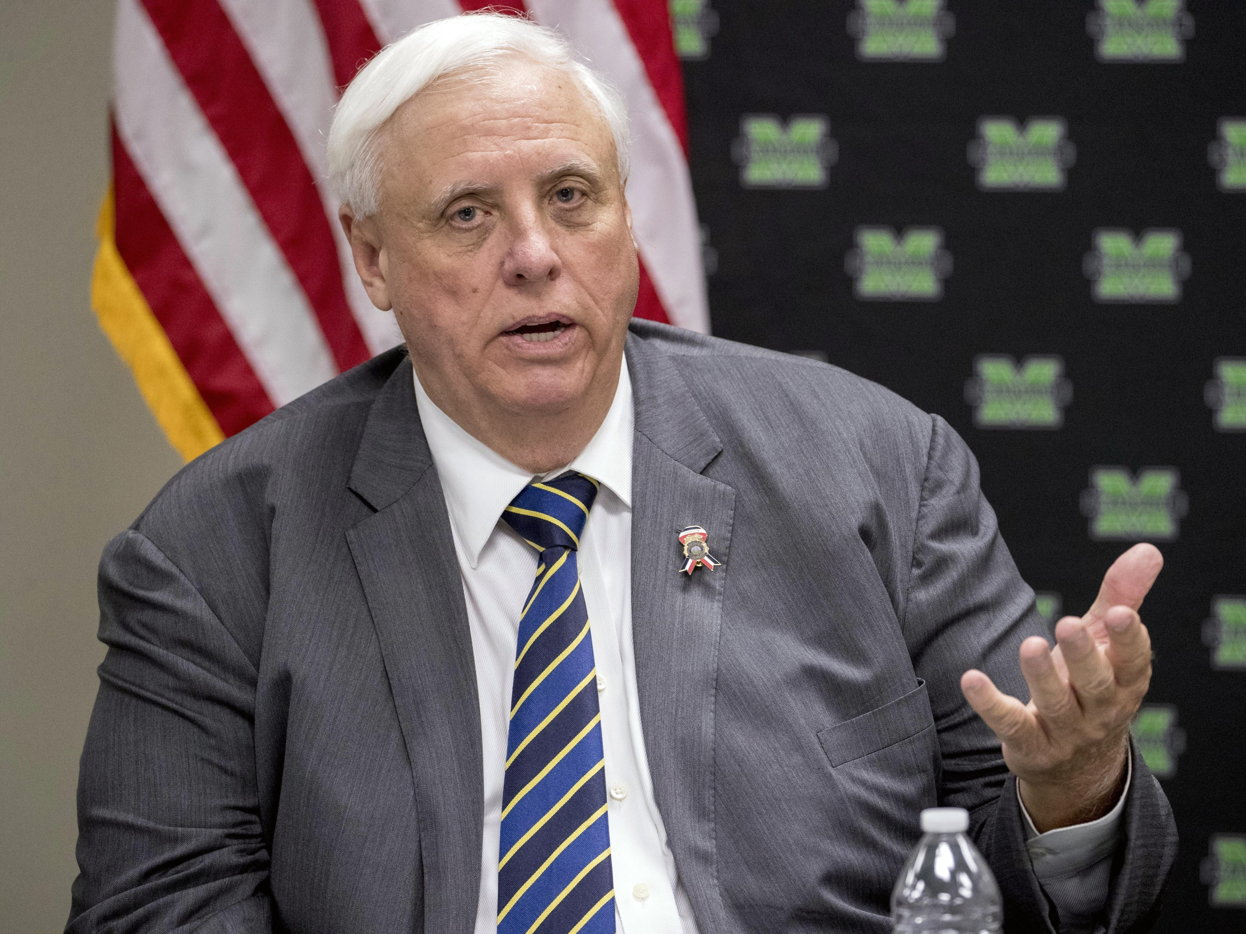 caption: West Virginia Gov. Jim Justice, pictured in July, said all 31 graduating correctional cadets would be fired. An investigation found the salute started in the second or third week of training "as a sign of respect" for an instructor.