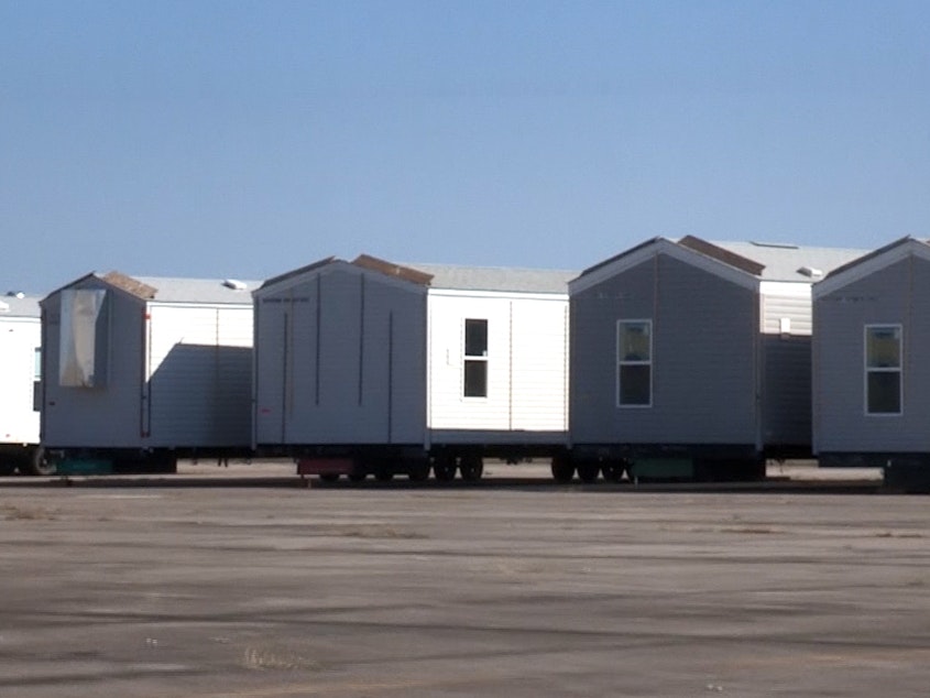 caption: FEMA disaster relief trailers in storage.