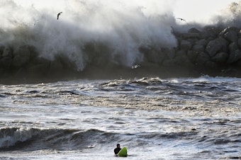 caption: A series of storms brought massive, damaging waves to much of the California coast earlier this year. The pier in Ventura, Calif. was damaged by the waves.
