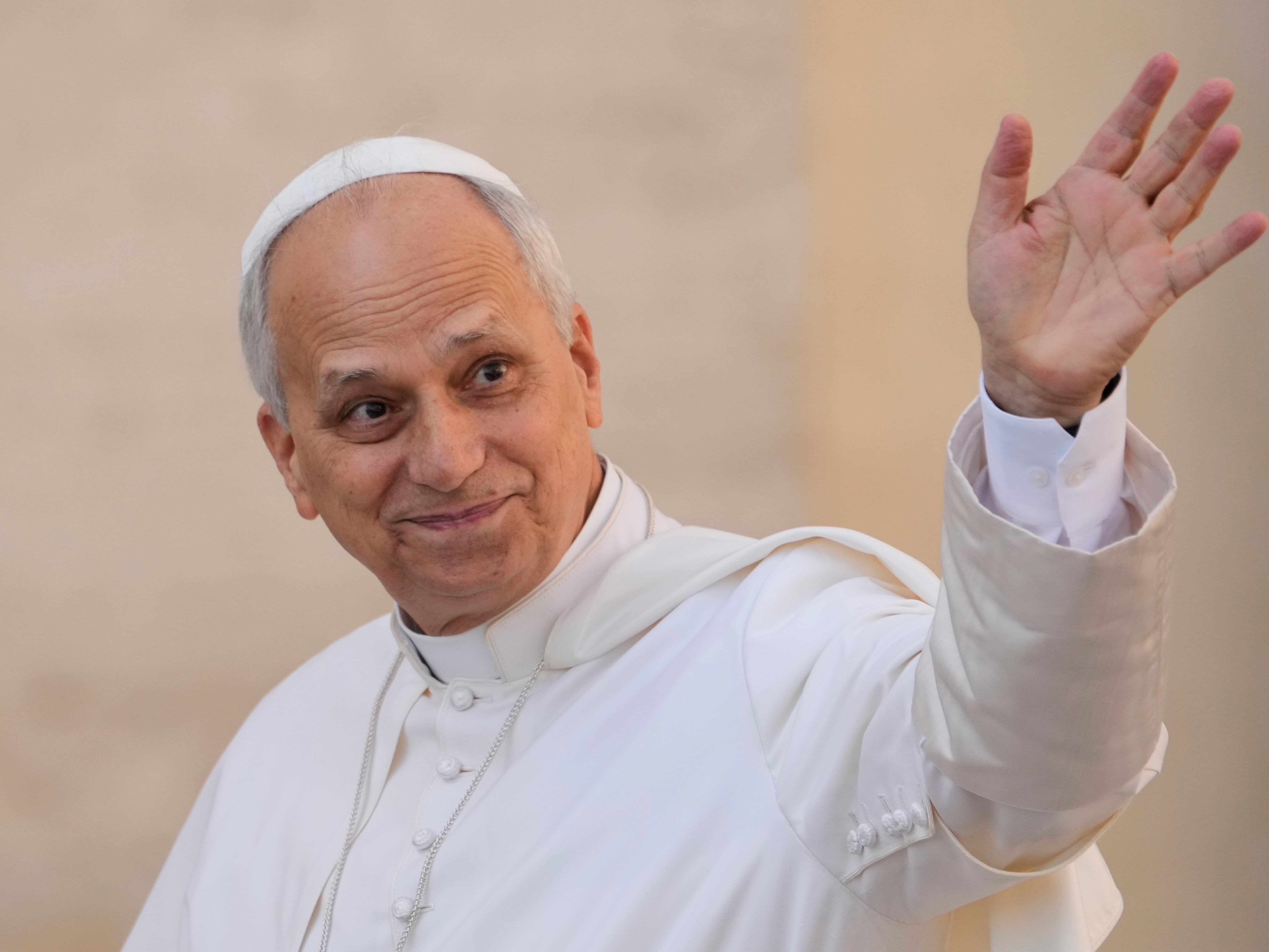 caption: Pope Leo XIV waves as he arrives for his weekly general audience in St. Peter's Square at the Vatican on Oct.1, 2025.