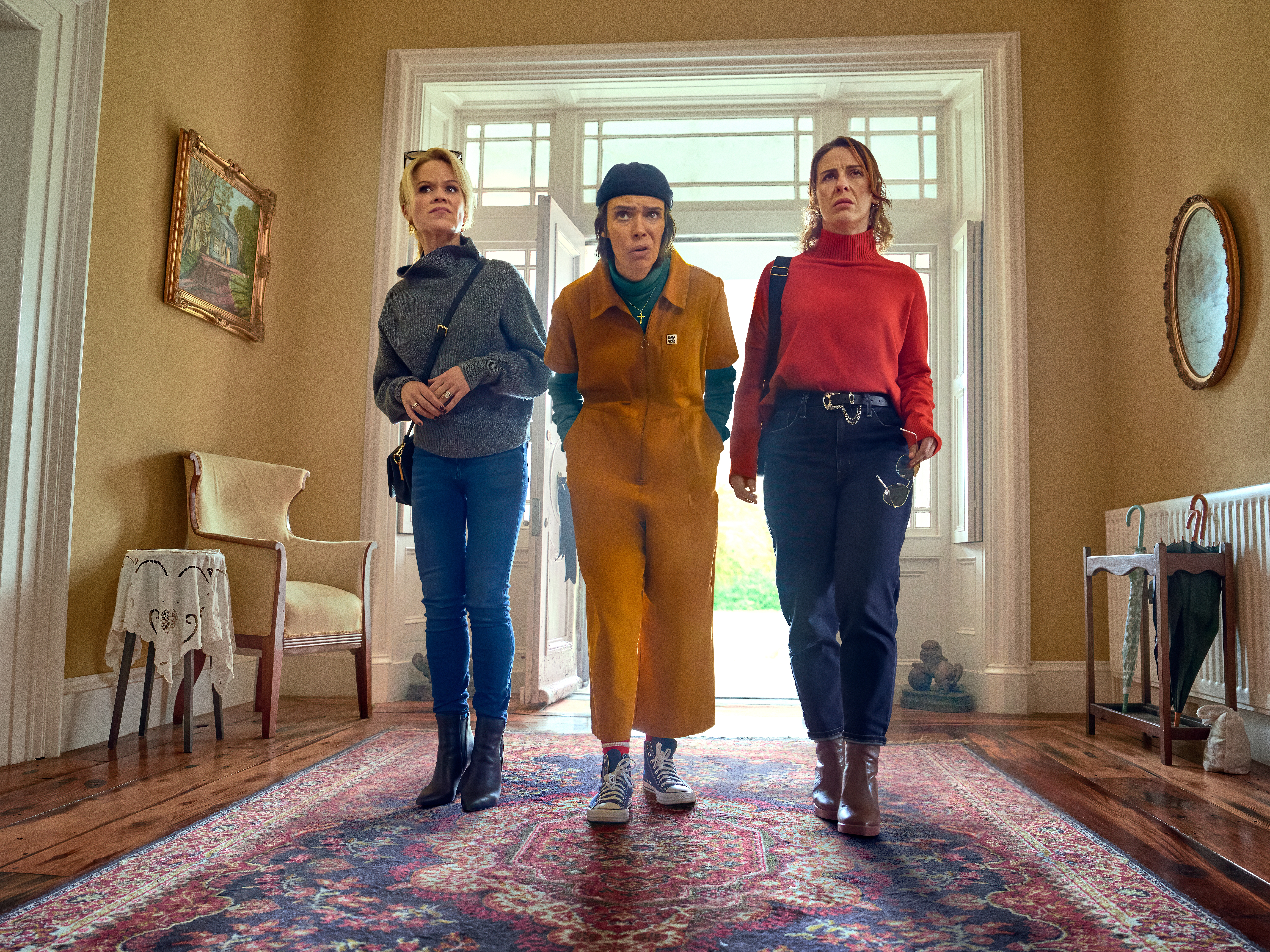 caption: Sinéad Keenan, Caoilfhionn Dunne and Roísín Gallagher play friends investigating a suspicious death in <em>How to Get to Heaven from Belfast</em>.