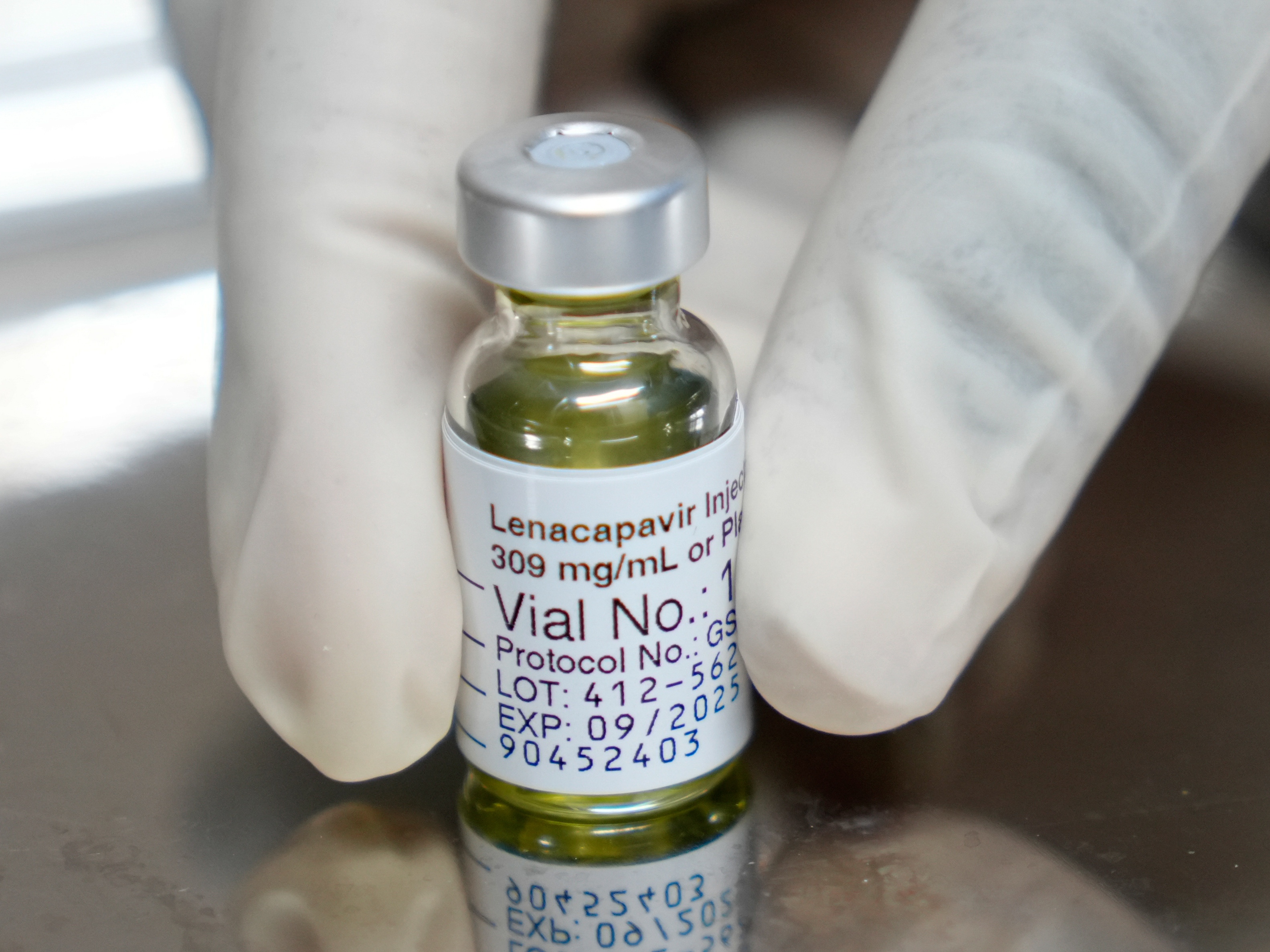 caption: A vial of lenacapavir, the new HIV prevention injectable drug that only needs to be administered twice yearly but provides almost complete protection.