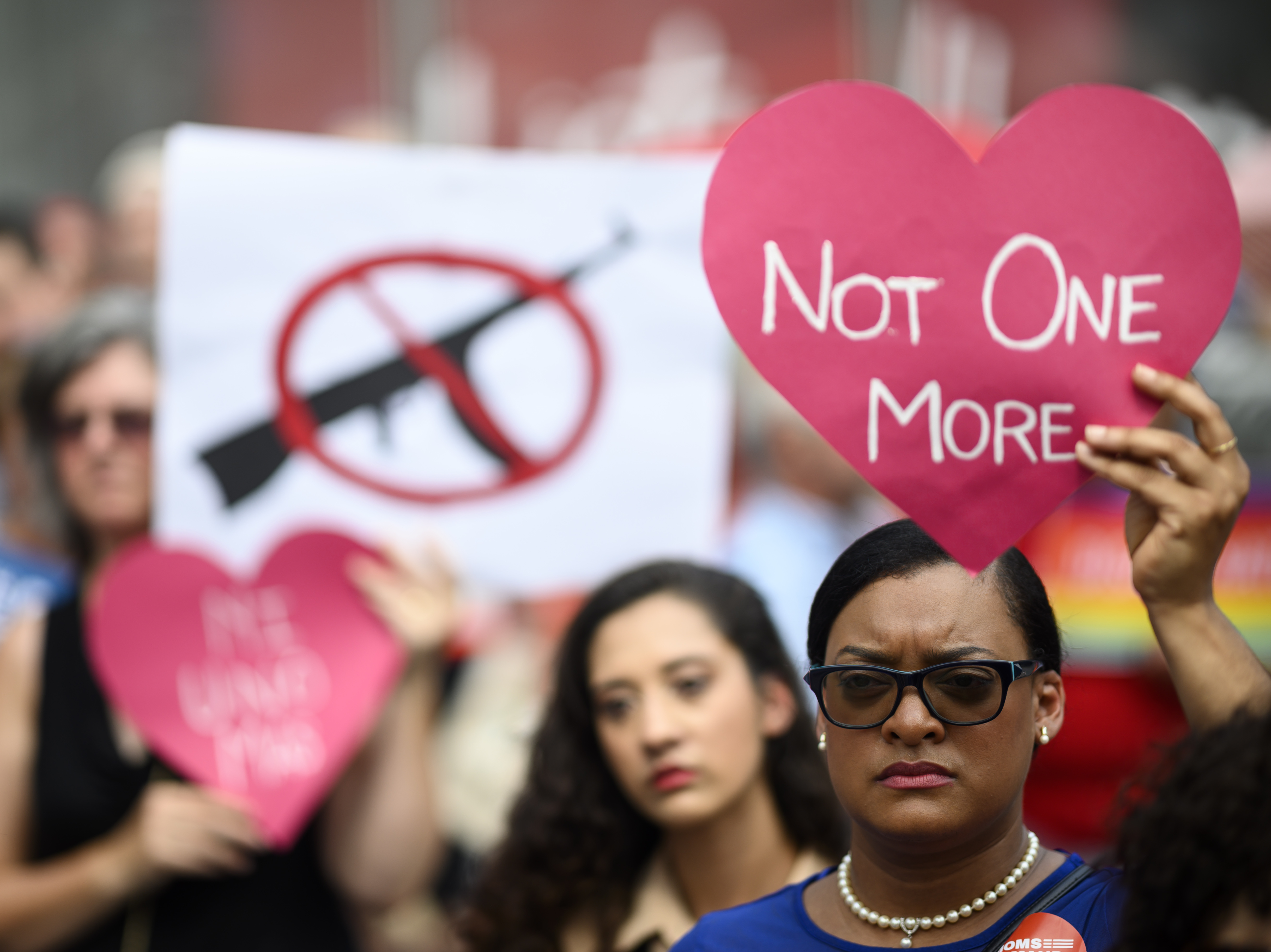 caption: Protestors take part in a rally of Moms against gun violence and calling for Federal Background Checks on August 18, 2019 in New York City.
