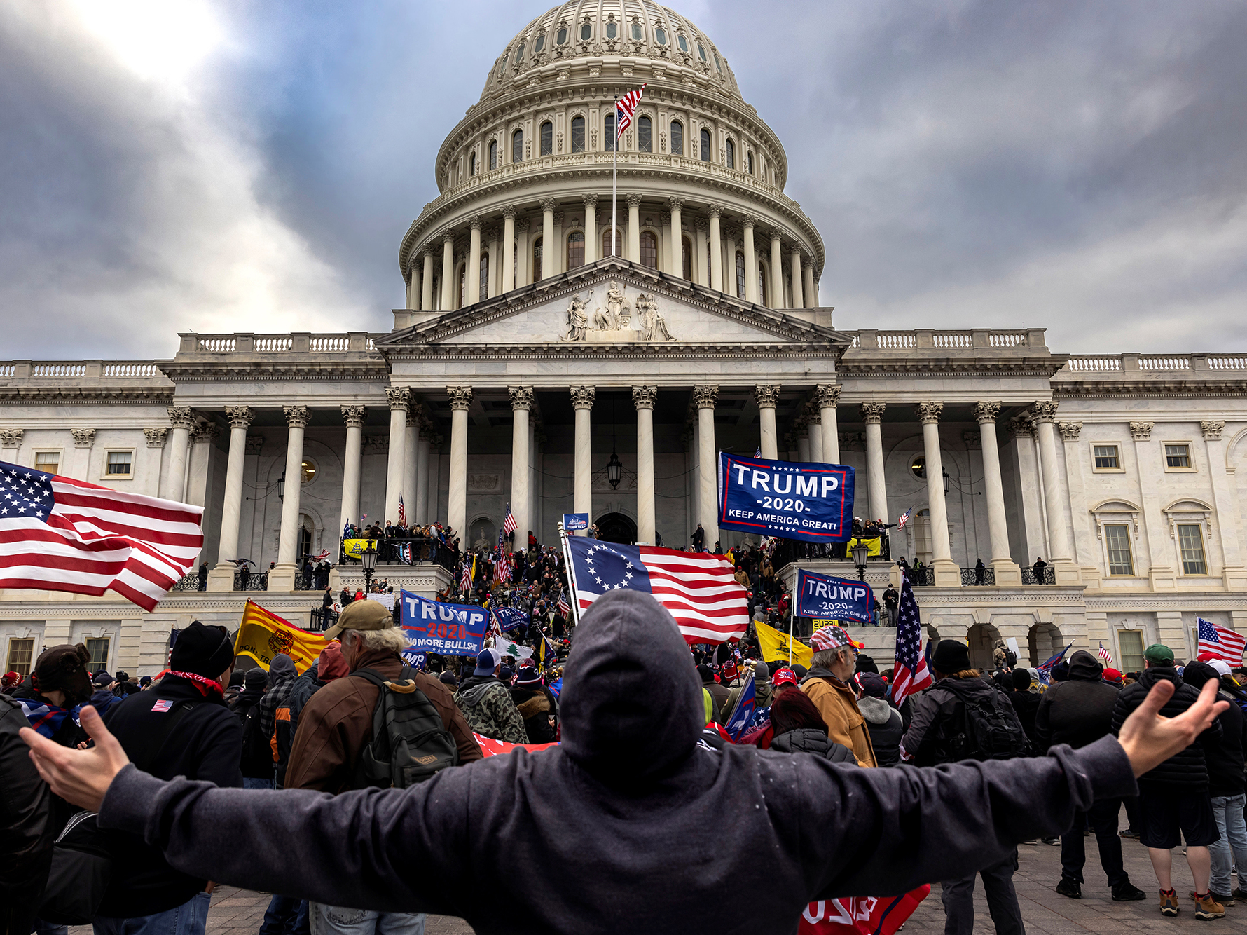 caption: Pro-Trump protesters gather in front of the U.S. Capitol Building on Jan. 6, 2021 in Washington, D.C. They gathered to protest the ratification of President-elect Joe Biden's Electoral College victory over President Trump in the 2020 election. A pro-Trump mob later stormed the Capitol, breaking windows and clashing with police officers. Five people died as a result.