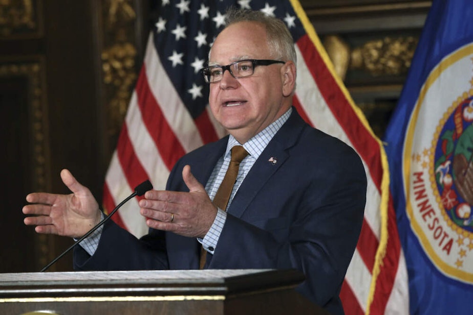 caption: Minnesota Gov. Tim Walz addresses a news conference in 2019. (Jim Mone/AP)