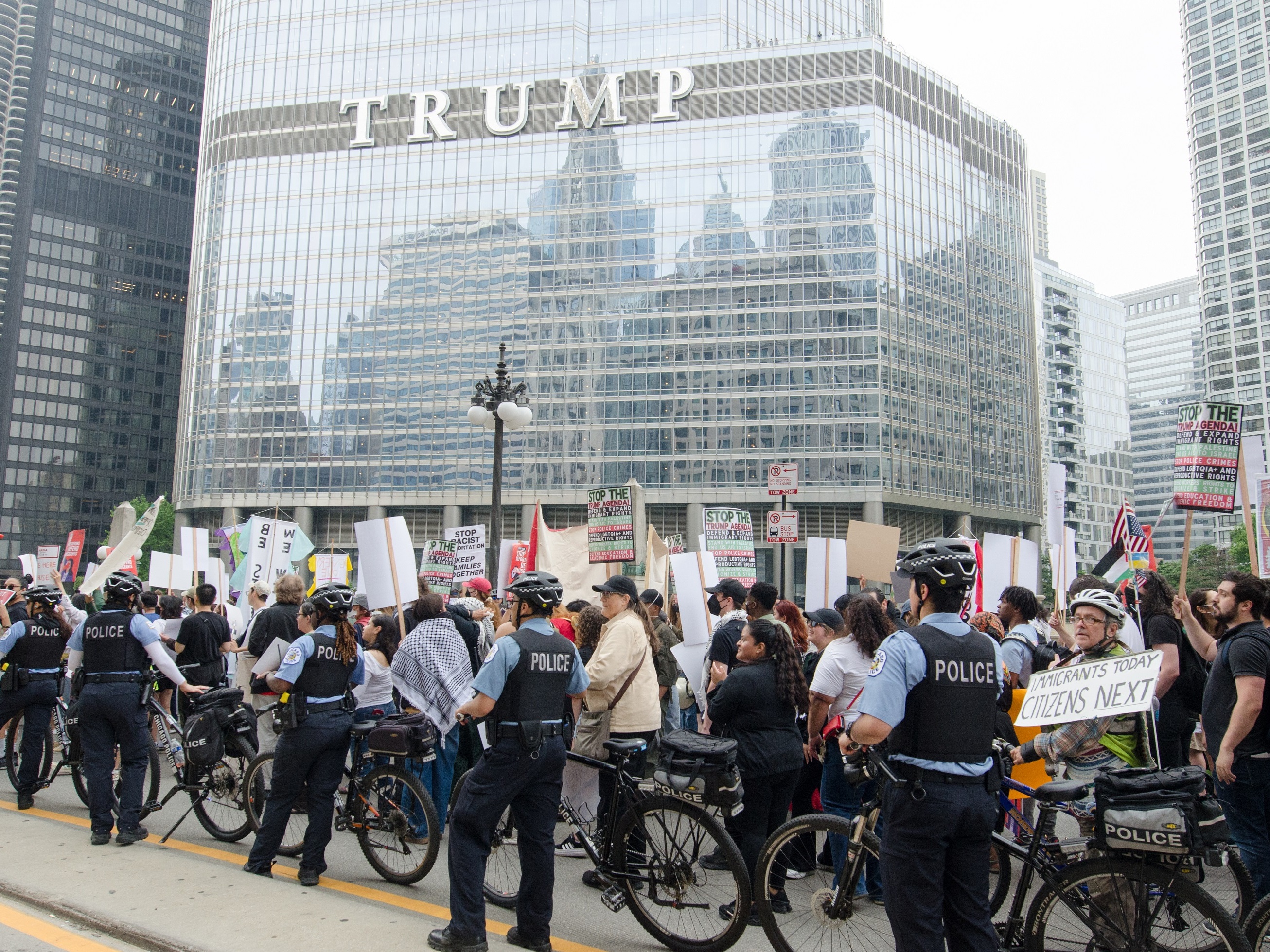 caption: Protesters march through downtown Chicago on June 12, during the second day of demonstrations against Immigration and Customs Enforcement (ICE) raids and President Trump's immigration policies. Carrying signs reading 'Abolish ICE' and 'No More Deportations,' thousands rally in solidarity with immigrant communities, chanting for justice and an end to family separations.