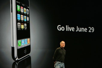 caption: Apple Inc. CEO Steve Jobs discusses the iPhone during a June 2007 keynote address.