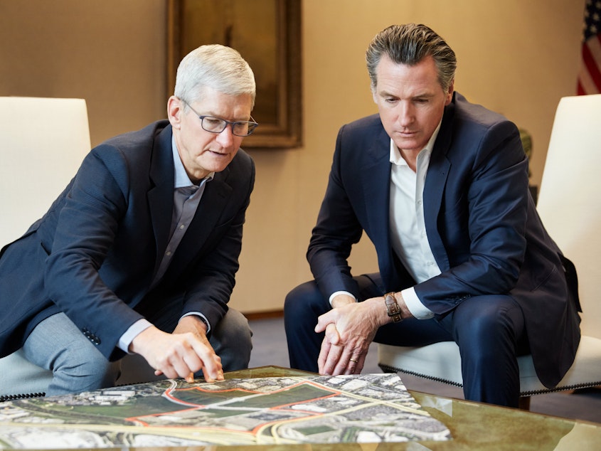 caption: Apple CEO Tim Cook and California Gov. Gavin Newsom unveiled the tech company's plan to help ease the housing crisis, with Apple pledging $2.5 billion for mortgages, development and other initiatives.