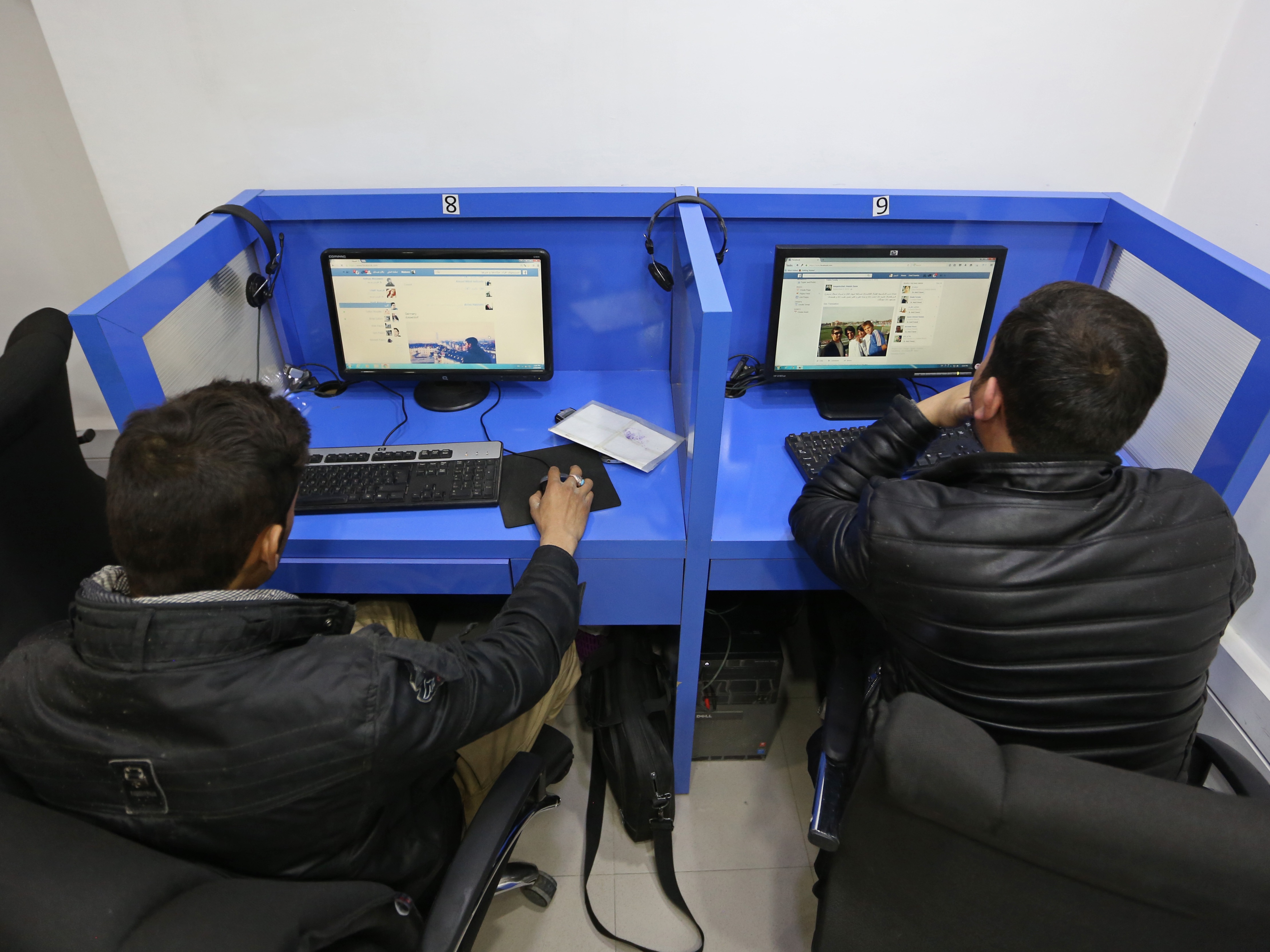 caption: Afghanis access social media websites at a private internet cafe in Kabul, Afghanistan, on Feb. 10, 2016.