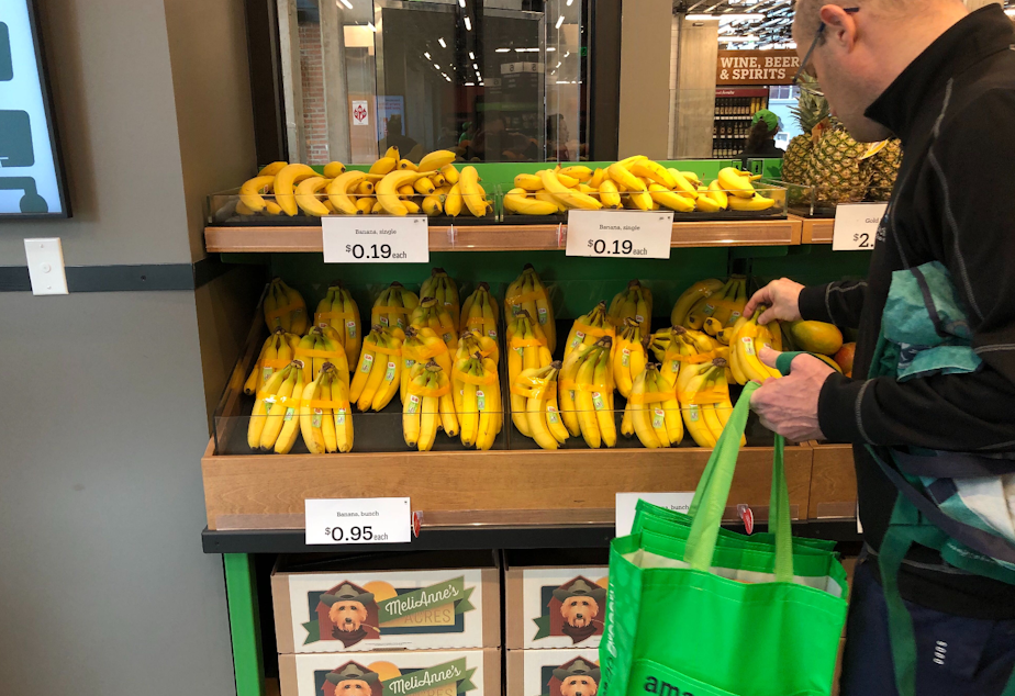 caption: Amazon Go Grocery is Amazon's grab-and-go food store with no cashiers. To keep things simple for the A.I., bananas are sold as singles and in taped-together groups of five.