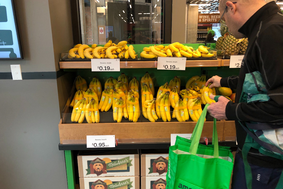 caption: Amazon Go Grocery is Amazon's grab-and-go food store with no cashiers. To keep things simple for the A.I., bananas are sold as singles and in taped-together groups of five.