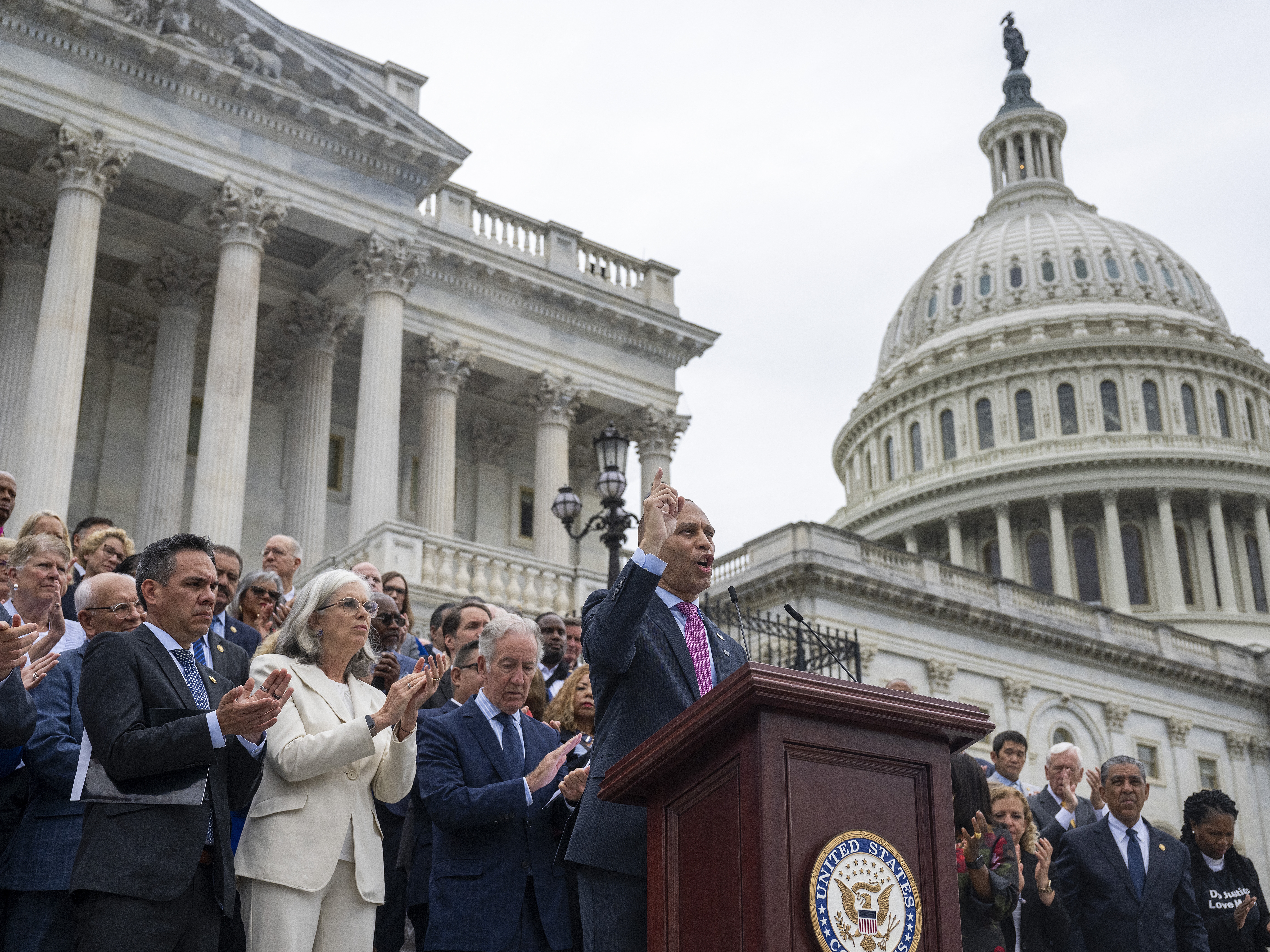 caption: Congressional Democrats, led by Rep. Hakeem Jeffries, House Democratic Leader, hold a press conference on the steps of the U.S. Capitol after the Senate passed the "Big Beautiful Bill Act" on July 2.