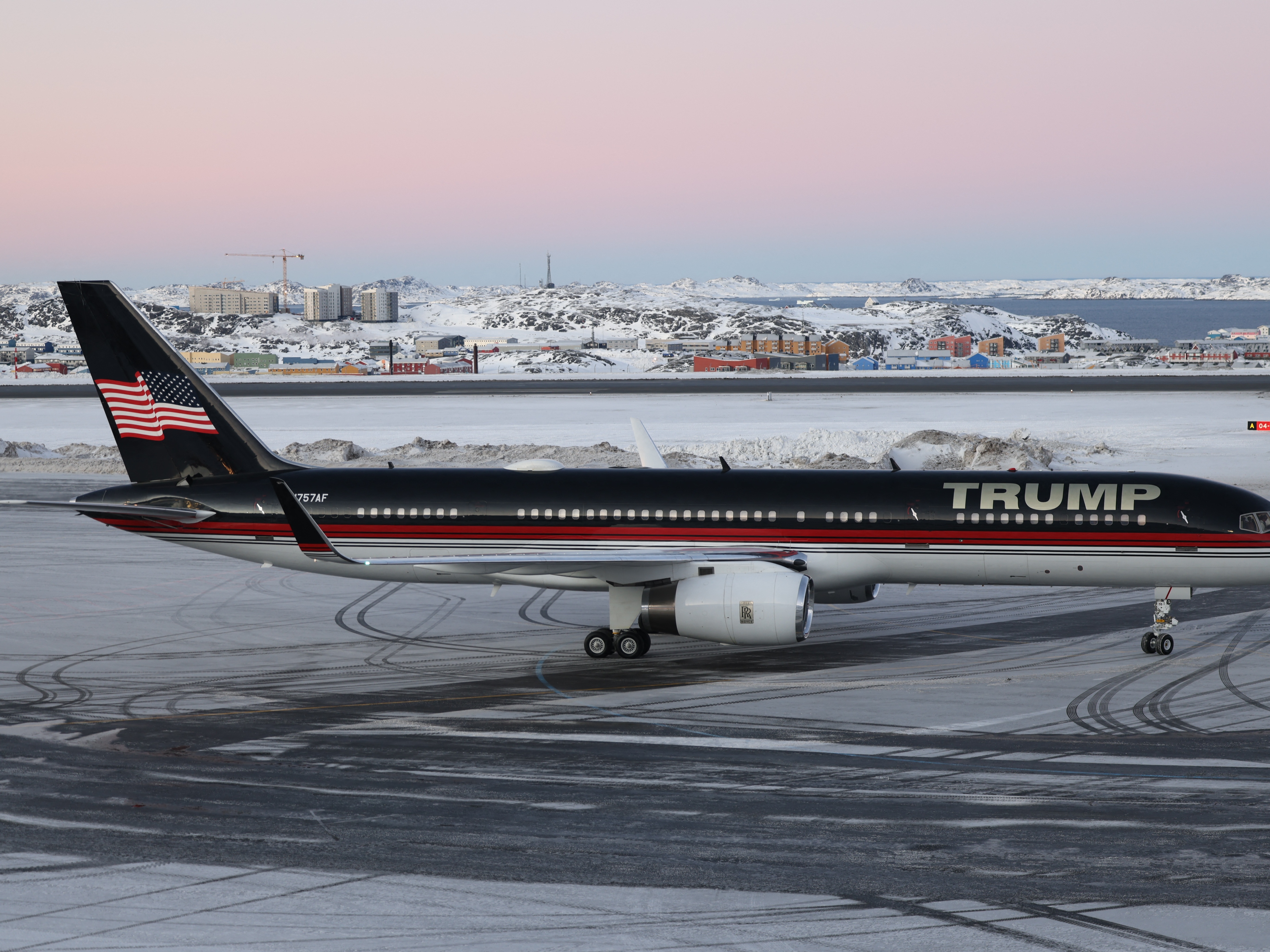 caption: A plane carrying Donald Trump Jr., the son of President-elect Donald Trump, arrives in Nuuk, Greenland, on Tuesday. The private visit to the Danish autonomous territory comes amid stepped up rhetoric from the president-elect that he wants to incorporate Greenland into the U.S.