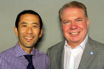 caption: Michael Shiosaki and Mayor Ed Murray at a 'StoryCorps' booth in Seattle.