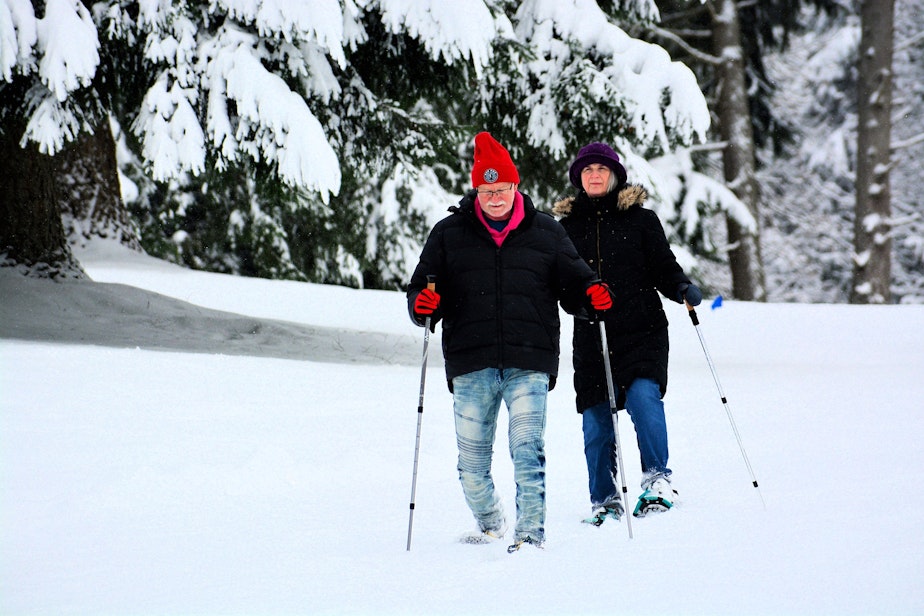 caption: John and Garnet Osborn of Lake Forest Park try out their new snowshoes in Abbey View cemetery in Brier in Snohomish County (just across King County line from Lake Forest Park).