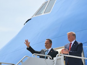 caption: President Trump has been campaigning for Kentucky Republican Gov. Matt Bevin (left), who is on the ballot for reelection Tuesday. Above, they step off Air Force One in August at Louisville, Ky.'s airport.