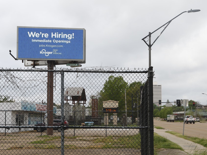 caption: Kroger advertises it's hiring on a billboard in Jackson, Miss., on Monday.